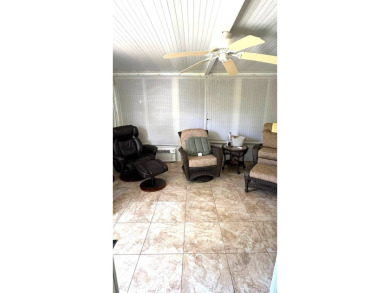 This move-in-ready gem has 2 bedrooms, 2 baths, and is located on Sabal Springs Golf and Racquet Club in Florida - for sale on GolfHomes.com, golf home, golf lot