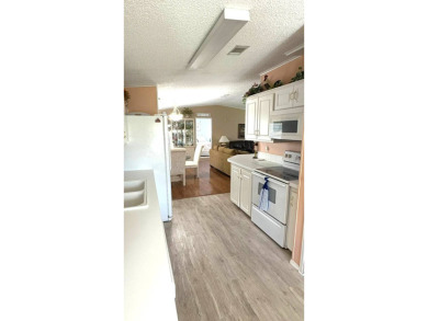 This move-in-ready gem has 2 bedrooms, 2 baths, and is located on Sabal Springs Golf and Racquet Club in Florida - for sale on GolfHomes.com, golf home, golf lot