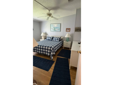 This move-in-ready gem has 2 bedrooms, 2 baths, and is located on Sabal Springs Golf and Racquet Club in Florida - for sale on GolfHomes.com, golf home, golf lot