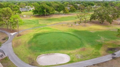 One or more photo(s) has been virtually staged. Nestled in on Highland Lakes Executive Golf Course in Florida - for sale on GolfHomes.com, golf home, golf lot