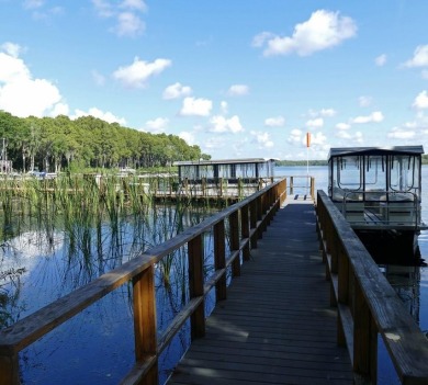 One or more photo(s) has been virtually staged. Nestled in on Highland Lakes Executive Golf Course in Florida - for sale on GolfHomes.com, golf home, golf lot