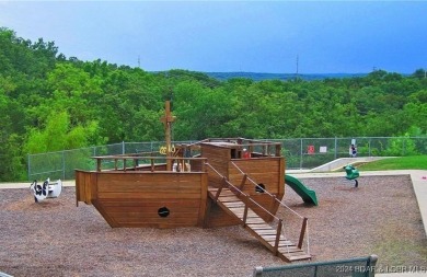 Four Seasons Building Lot that is fairly level and wooded on Seasons Ridge At Four Seasons in Missouri - for sale on GolfHomes.com, golf home, golf lot