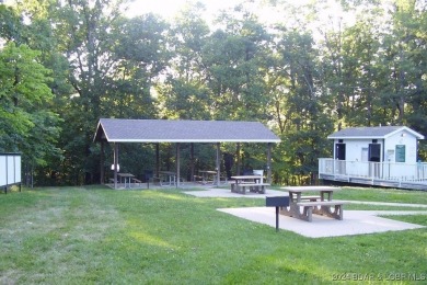 Four Seasons Building Lot that is fairly level and wooded on Seasons Ridge At Four Seasons in Missouri - for sale on GolfHomes.com, golf home, golf lot