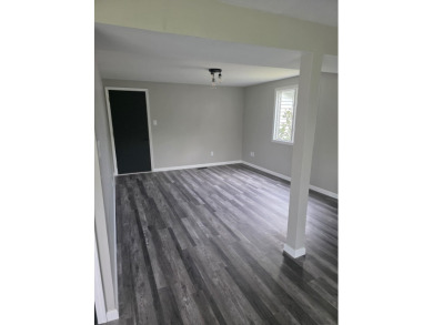 Welcome to this beautifully updated 3-bedroom, 3-bathroom home on Lake of Four Seasons Country Club in Indiana - for sale on GolfHomes.com, golf home, golf lot