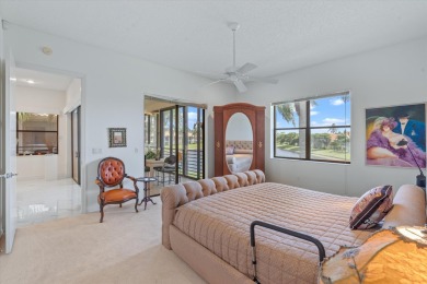 Stunning second-floor condo with breathtaking lake views! This on Boca Delray Golf and Country Club in Florida - for sale on GolfHomes.com, golf home, golf lot