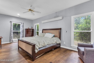 Tucked away on a spacious, pie-shaped lot, this hidden gem on on Olde Point Golf and Country Club in North Carolina - for sale on GolfHomes.com, golf home, golf lot