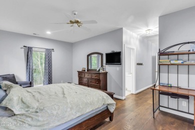 Tucked away on a spacious, pie-shaped lot, this hidden gem on on Olde Point Golf and Country Club in North Carolina - for sale on GolfHomes.com, golf home, golf lot