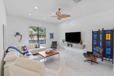 Stunning second-floor condo with breathtaking lake views! This on Boca Delray Golf and Country Club in Florida - for sale on GolfHomes.com, golf home, golf lot