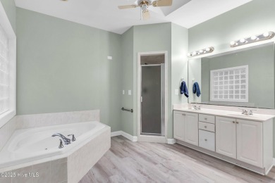 Tucked away on a spacious, pie-shaped lot, this hidden gem on on Olde Point Golf and Country Club in North Carolina - for sale on GolfHomes.com, golf home, golf lot