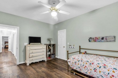 Tucked away on a spacious, pie-shaped lot, this hidden gem on on Olde Point Golf and Country Club in North Carolina - for sale on GolfHomes.com, golf home, golf lot