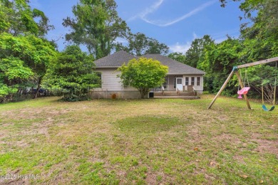Tucked away on a spacious, pie-shaped lot, this hidden gem on on Olde Point Golf and Country Club in North Carolina - for sale on GolfHomes.com, golf home, golf lot