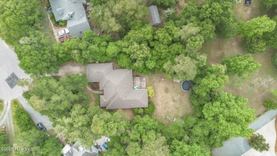 Tucked away on a spacious, pie-shaped lot, this hidden gem on on Olde Point Golf and Country Club in North Carolina - for sale on GolfHomes.com, golf home, golf lot
