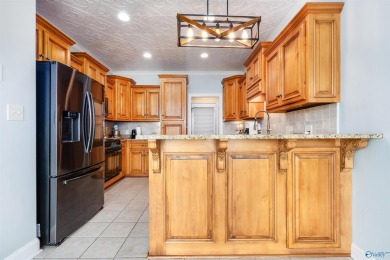 Beautiful brick home overlooking hole #9 at Canebrake Golf on Canebrake Golf Club in Alabama - for sale on GolfHomes.com, golf home, golf lot