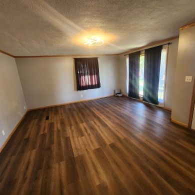 Discover comfort and convenience in this charming brick ranch on Hillcrest Golf and Country Club in South Dakota - for sale on GolfHomes.com, golf home, golf lot