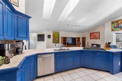 This single family pool home is nestled on a lush and tropical on The Wanderers Club in Florida - for sale on GolfHomes.com, golf home, golf lot