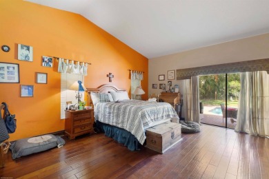 This single family pool home is nestled on a lush and tropical on The Wanderers Club in Florida - for sale on GolfHomes.com, golf home, golf lot