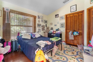 This single family pool home is nestled on a lush and tropical on The Wanderers Club in Florida - for sale on GolfHomes.com, golf home, golf lot