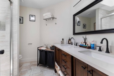 This single family pool home is nestled on a lush and tropical on The Wanderers Club in Florida - for sale on GolfHomes.com, golf home, golf lot