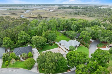 Tucked on a private 1.3-acre lot with no neighbor directly on Jacksonville Beach Golf Course in Florida - for sale on GolfHomes.com, golf home, golf lot