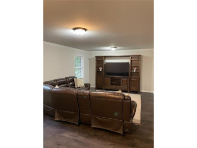 Discover a rare gem in the sought-after Pine Ridge Country Club on Collins Hill Golf Club in Georgia - for sale on GolfHomes.com, golf home, golf lot