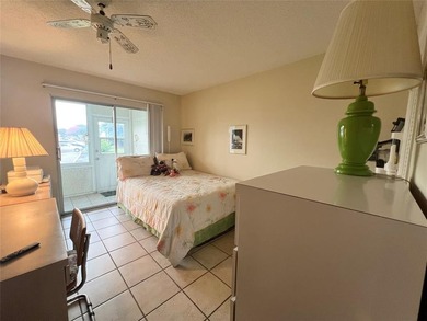 ***CORNER CONDO*** WELL MAINTAINED FIRST FLOOR,  2 BEDROOM, 1.5 on Hillsboro Pines Golf in Florida - for sale on GolfHomes.com, golf home, golf lot