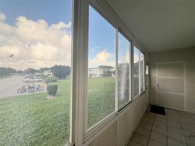 ***CORNER CONDO*** WELL MAINTAINED FIRST FLOOR,  2 BEDROOM, 1.5 on Hillsboro Pines Golf in Florida - for sale on GolfHomes.com, golf home, golf lot