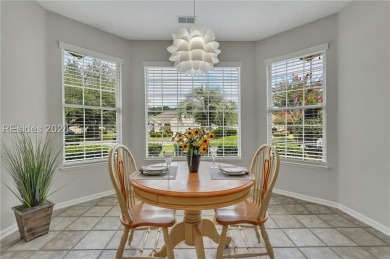 Located in Sun City Hilton Head, this charming Hatteras model on Hidden Cypress Golf Club in South Carolina - for sale on GolfHomes.com, golf home, golf lot