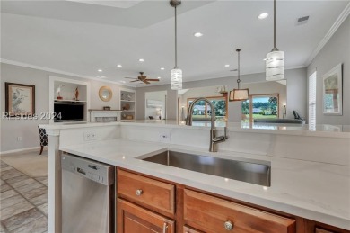 Located in Sun City Hilton Head, this charming Hatteras model on Hidden Cypress Golf Club in South Carolina - for sale on GolfHomes.com, golf home, golf lot