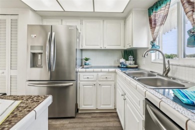 Stunning golf course and pond views from a light-filled corner on Seminole Lake Country Club in Florida - for sale on GolfHomes.com, golf home, golf lot