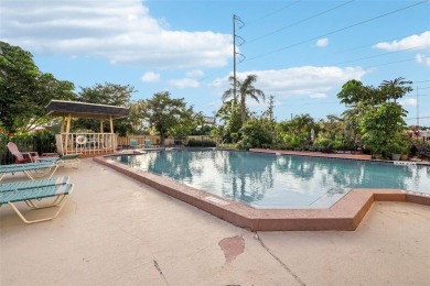 Stunning golf course and pond views from a light-filled corner on Seminole Lake Country Club in Florida - for sale on GolfHomes.com, golf home, golf lot