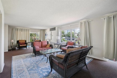 Stunning golf course and pond views from a light-filled corner on Seminole Lake Country Club in Florida - for sale on GolfHomes.com, golf home, golf lot