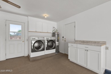 Location, location! Updated flooring (10/25) This 2118 sq ft on PalmBrook Country Club in Arizona - for sale on GolfHomes.com, golf home, golf lot