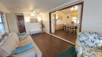 CHEERFUL HOME IN ACTIVE 55+ COMMUNITY! This one bed, two bath on River Run Golf Links in Florida - for sale on GolfHomes.com, golf home, golf lot