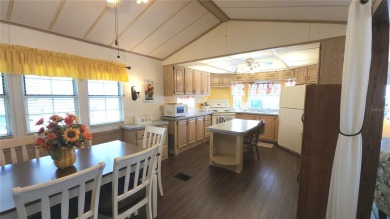 CHEERFUL HOME IN ACTIVE 55+ COMMUNITY! This one bed, two bath on River Run Golf Links in Florida - for sale on GolfHomes.com, golf home, golf lot