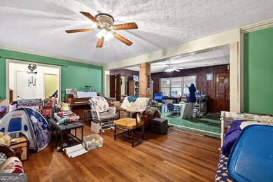 Nestled on one of the largest residential lots in the charming on College Park Municipal Golf Course in Georgia - for sale on GolfHomes.com, golf home, golf lot