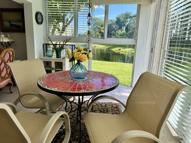 BEAUTIFUL CORNER UNIT WITH EAST EXPOSURE, LAKE, GOLF COURSE, AND on  in Florida - for sale on GolfHomes.com, golf home, golf lot