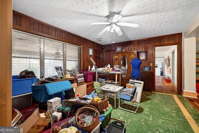 Nestled on one of the largest residential lots in the charming on College Park Municipal Golf Course in Georgia - for sale on GolfHomes.com, golf home, golf lot