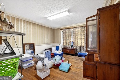 Nestled on one of the largest residential lots in the charming on College Park Municipal Golf Course in Georgia - for sale on GolfHomes.com, golf home, golf lot