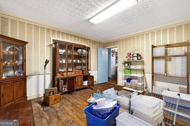 Nestled on one of the largest residential lots in the charming on College Park Municipal Golf Course in Georgia - for sale on GolfHomes.com, golf home, golf lot