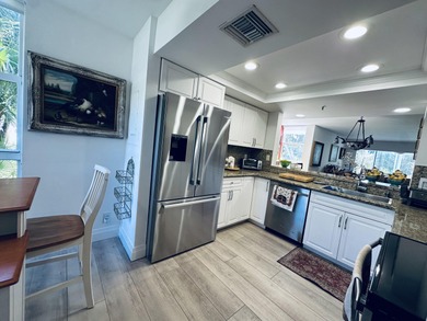 BEAUTIFUL CORNER UNIT WITH EAST EXPOSURE, LAKE, GOLF COURSE, AND on  in Florida - for sale on GolfHomes.com, golf home, golf lot