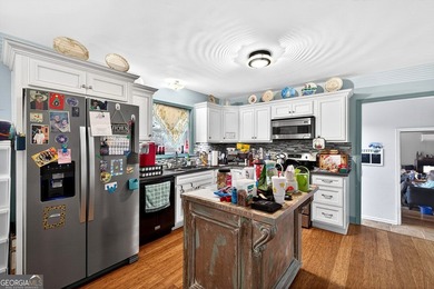 Nestled on one of the largest residential lots in the charming on College Park Municipal Golf Course in Georgia - for sale on GolfHomes.com, golf home, golf lot