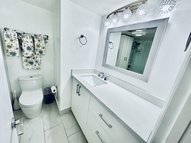 BEAUTIFUL CORNER UNIT WITH EAST EXPOSURE, LAKE, GOLF COURSE, AND on  in Florida - for sale on GolfHomes.com, golf home, golf lot