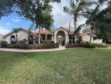 CUSTOM-BUILT POOL HOME OVERLOOKING THE 11TH HOLE IN SOUGHT-AFTER on St. Lucie Trail Golf Club in Florida - for sale on GolfHomes.com, golf home, golf lot