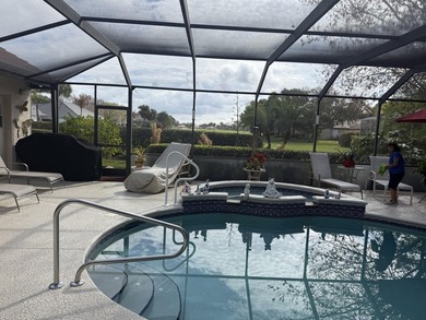 CUSTOM-BUILT POOL HOME OVERLOOKING THE 11TH HOLE IN SOUGHT-AFTER on St. Lucie Trail Golf Club in Florida - for sale on GolfHomes.com, golf home, golf lot