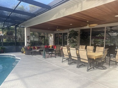 CUSTOM-BUILT POOL HOME OVERLOOKING THE 11TH HOLE IN SOUGHT-AFTER on St. Lucie Trail Golf Club in Florida - for sale on GolfHomes.com, golf home, golf lot