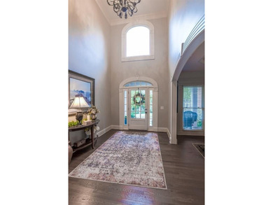 Experience refined living at 1041 Windermere Crossing an elegant on Windermere Golf Club in Georgia - for sale on GolfHomes.com, golf home, golf lot