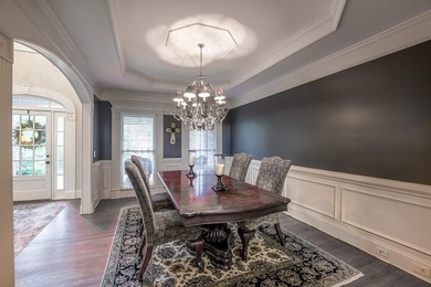 Experience refined living at 1041 Windermere Crossing an elegant on Windermere Golf Club in Georgia - for sale on GolfHomes.com, golf home, golf lot