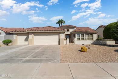 Discover this popular Palo Verde model nestled on the 7th green on Sun City Grand Golf Couse and Club in Arizona - for sale on GolfHomes.com, golf home, golf lot