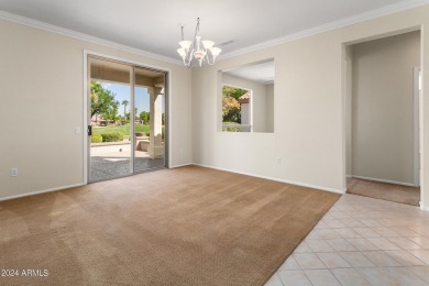 Discover this popular Palo Verde model nestled on the 7th green on Sun City Grand Golf Couse and Club in Arizona - for sale on GolfHomes.com, golf home, golf lot