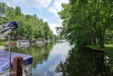 Charming Lakefront home! Embrace a lifestyle of comfort and on Lake Tansi Village Country Club in Tennessee - for sale on GolfHomes.com, golf home, golf lot